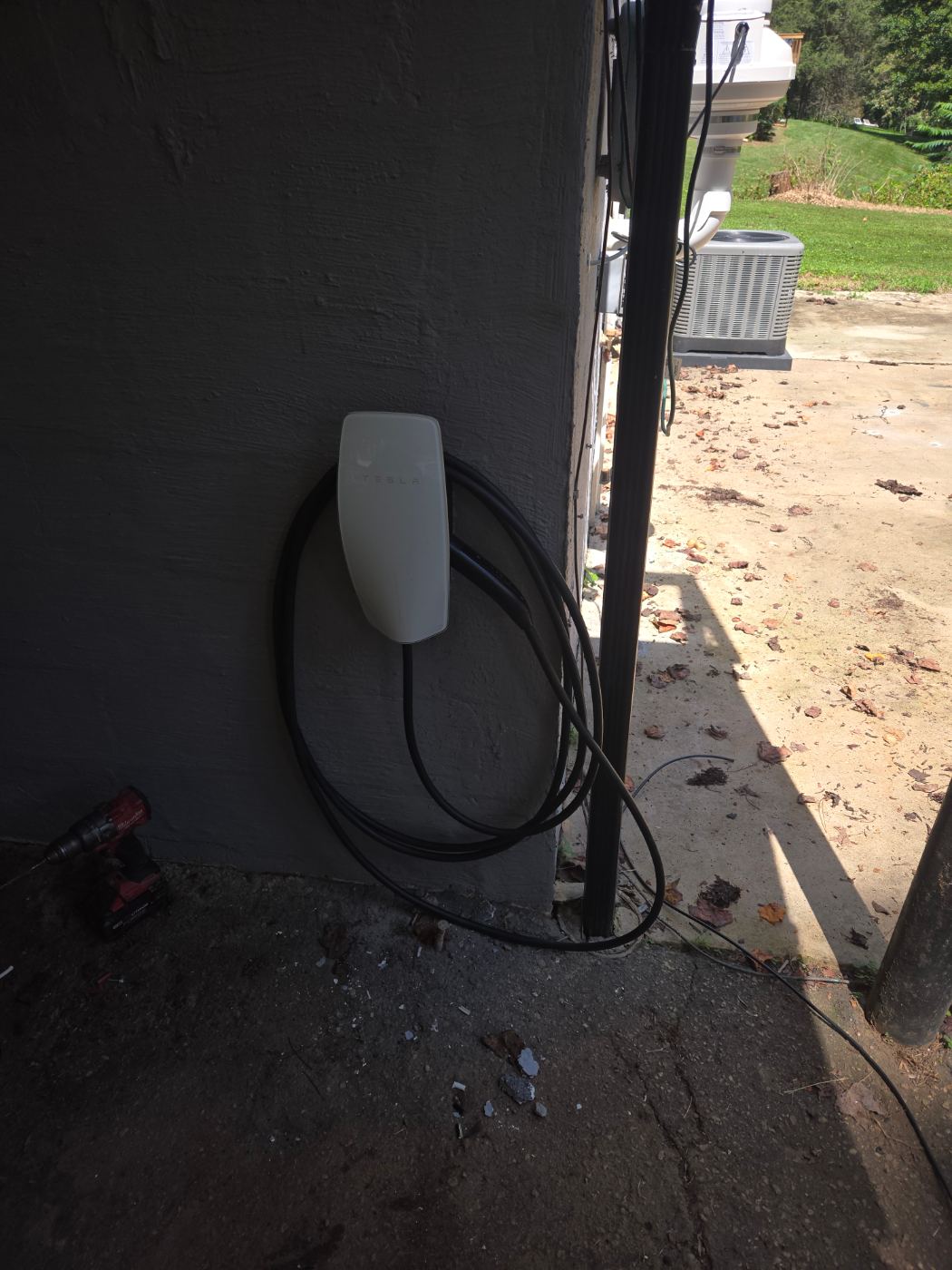 Outdoor EV charger wired on an exterior wall by Stickler’s Electrical Service near Hickory, NC