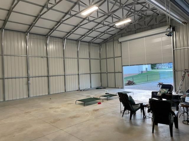 Inside a detached garage in Granite Falls, NC with conduit-run lighting and receptacles