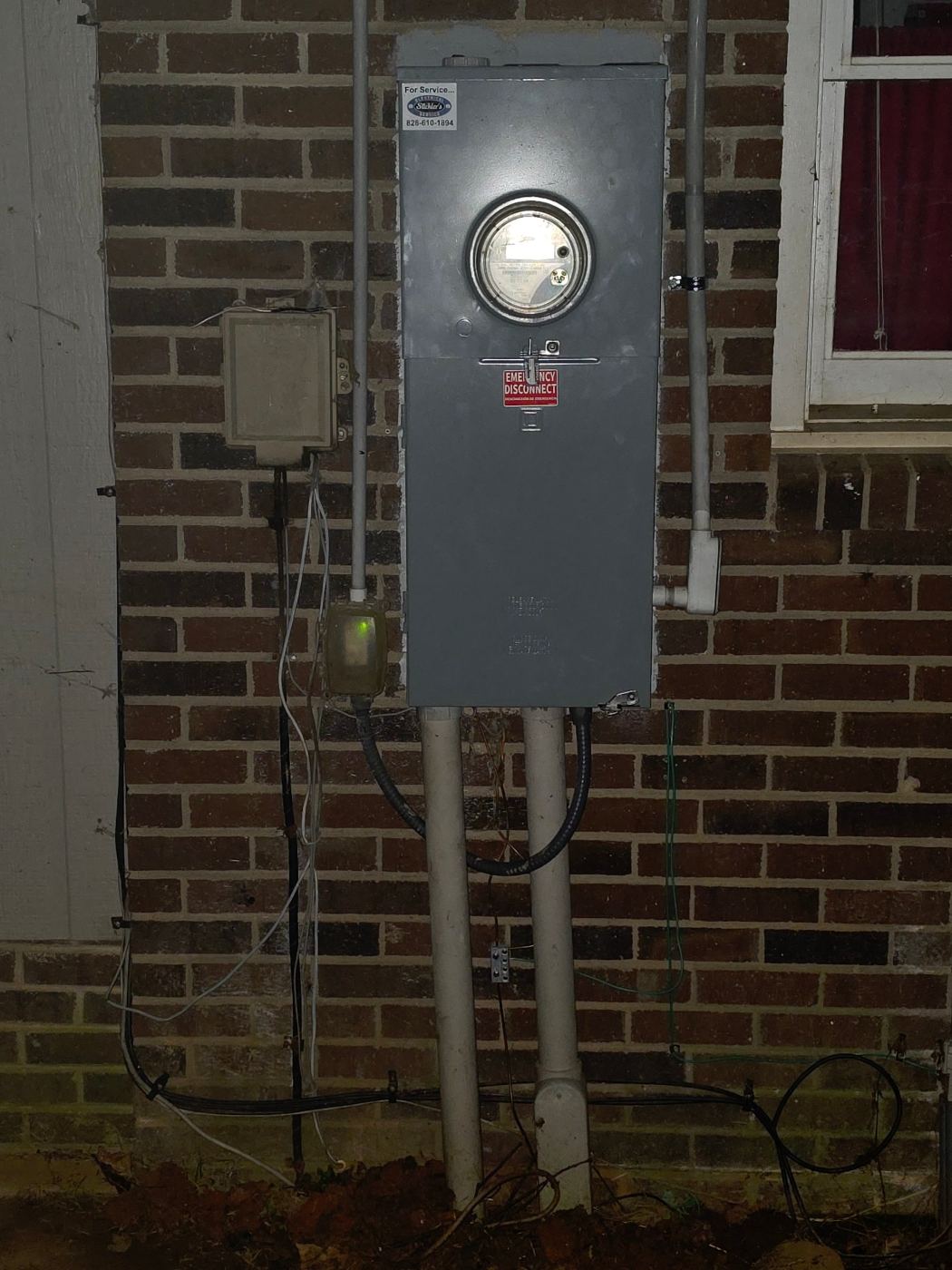New meter and emergency disconnect installed on a brick home in Lenoir, NC after a service change