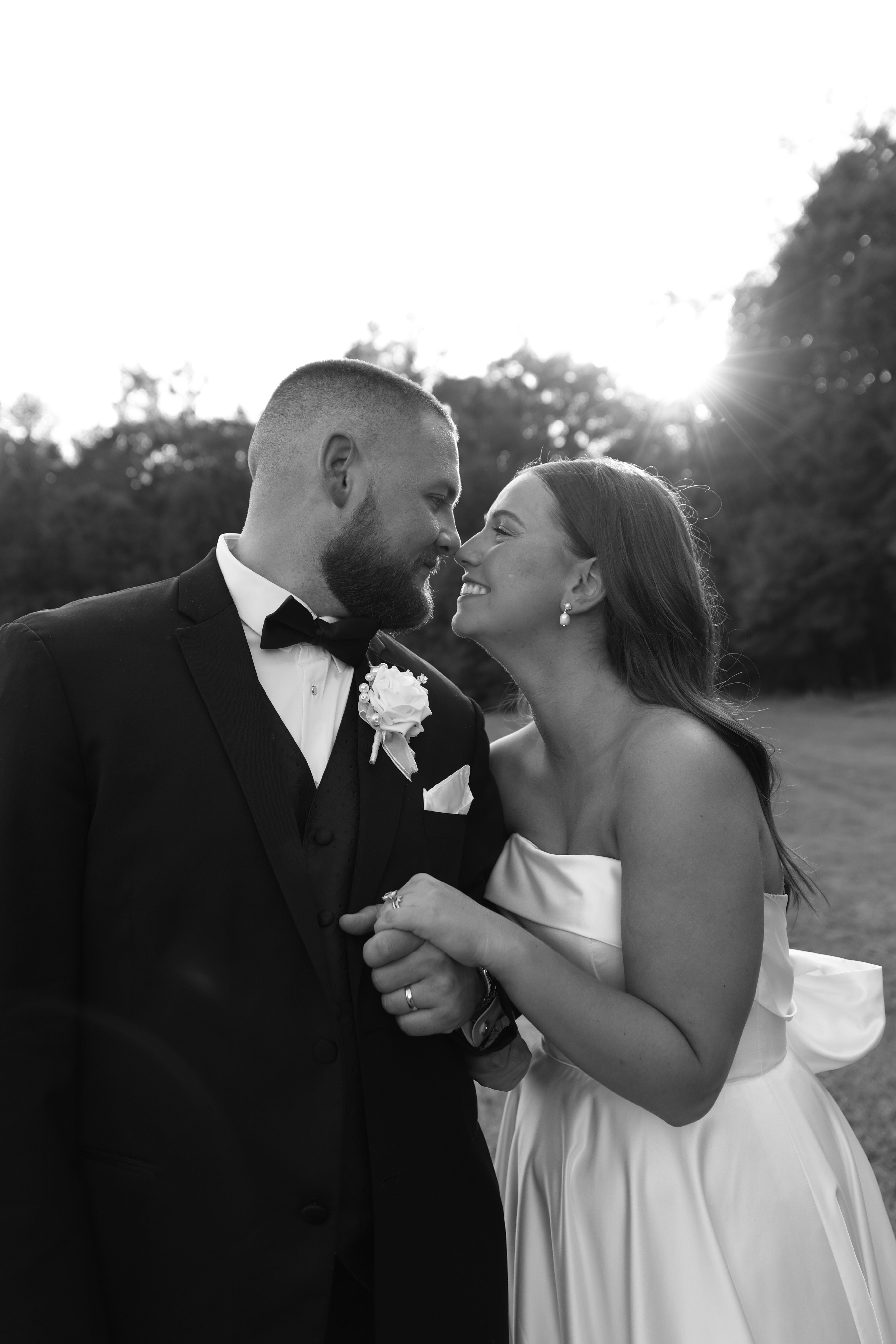 beautiful black and white photography of bride and groom in field at golden hour in the country near Clarke County, GA