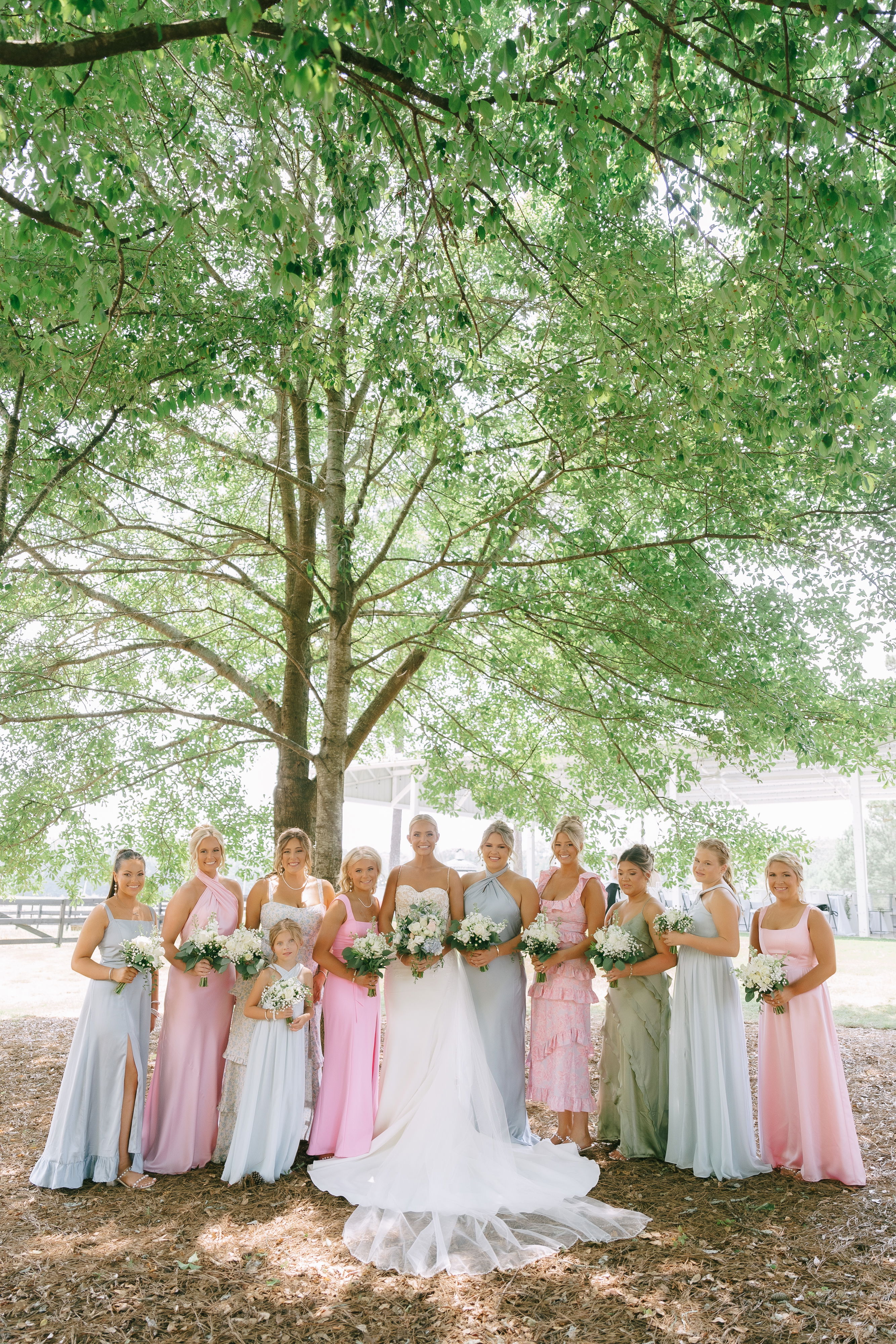 bridal party, bride and flower girl portrait with scenic background with trees and horses, near Athens, Georgia