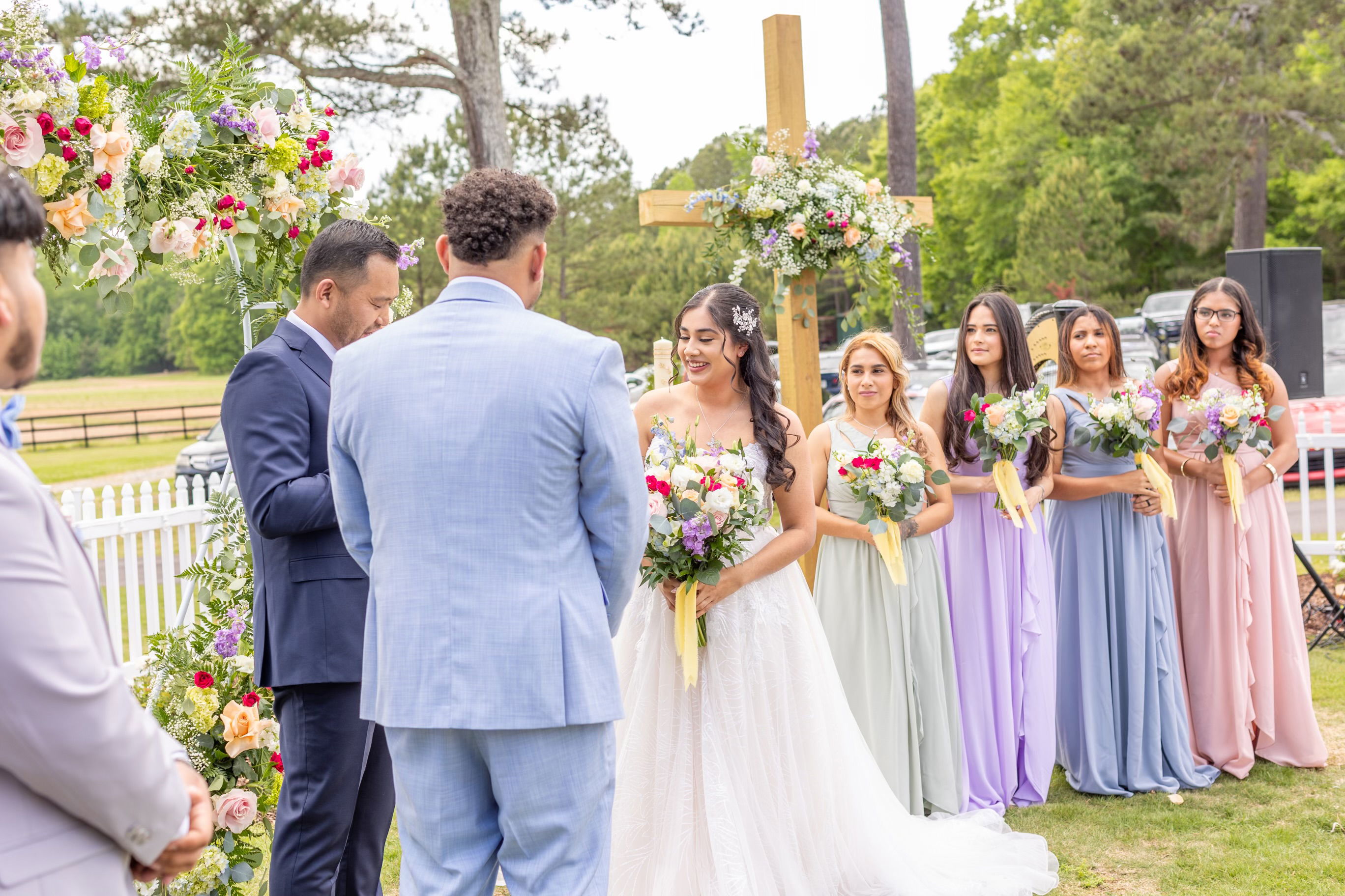 bride and groom exchanging vows with heart arch in courtyard garden near Winder, GA