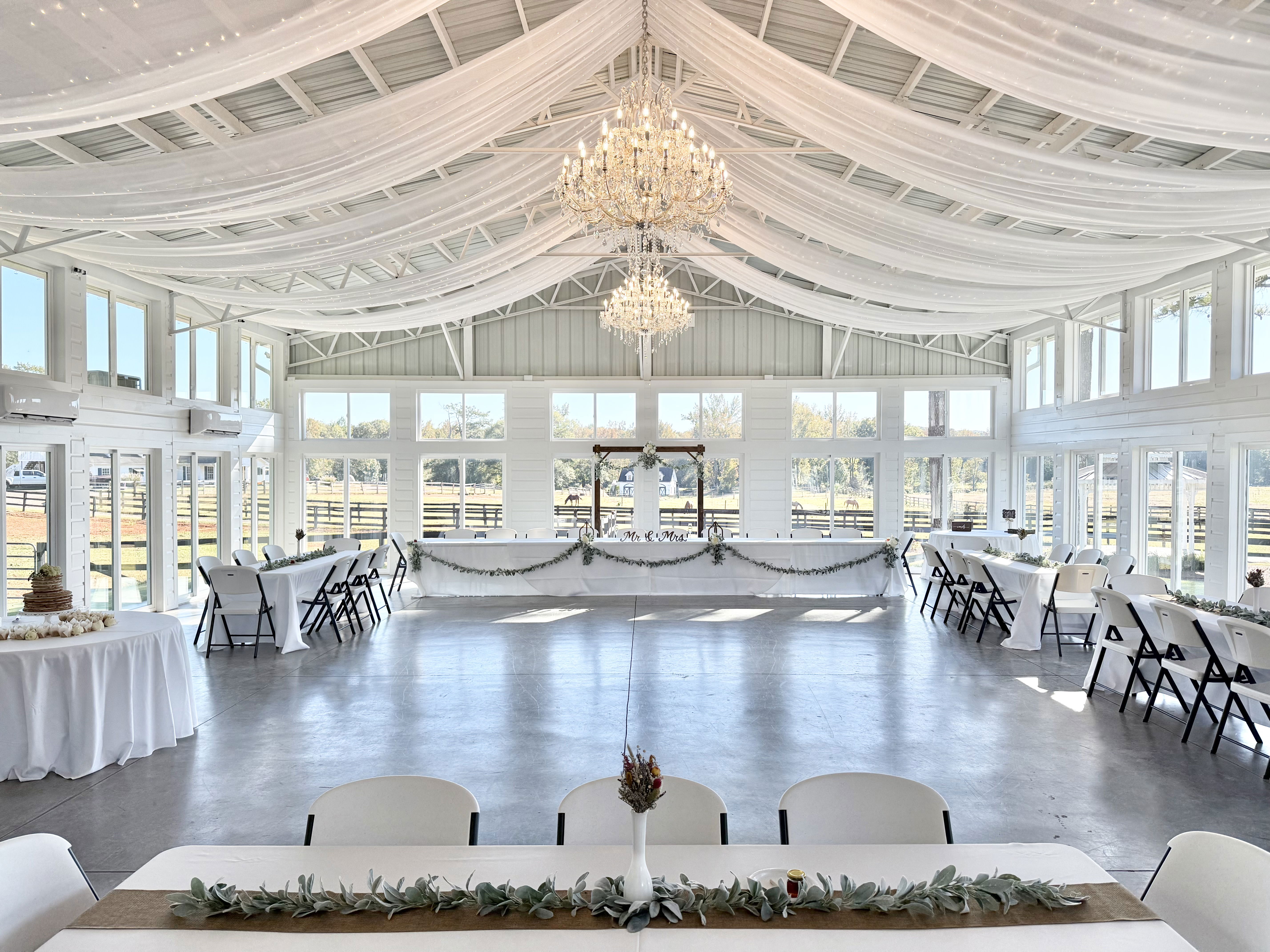 elegant ambience with draping, crystal chandeliers and expansive view for reception in Monroe, Georgia in Walton County, GA