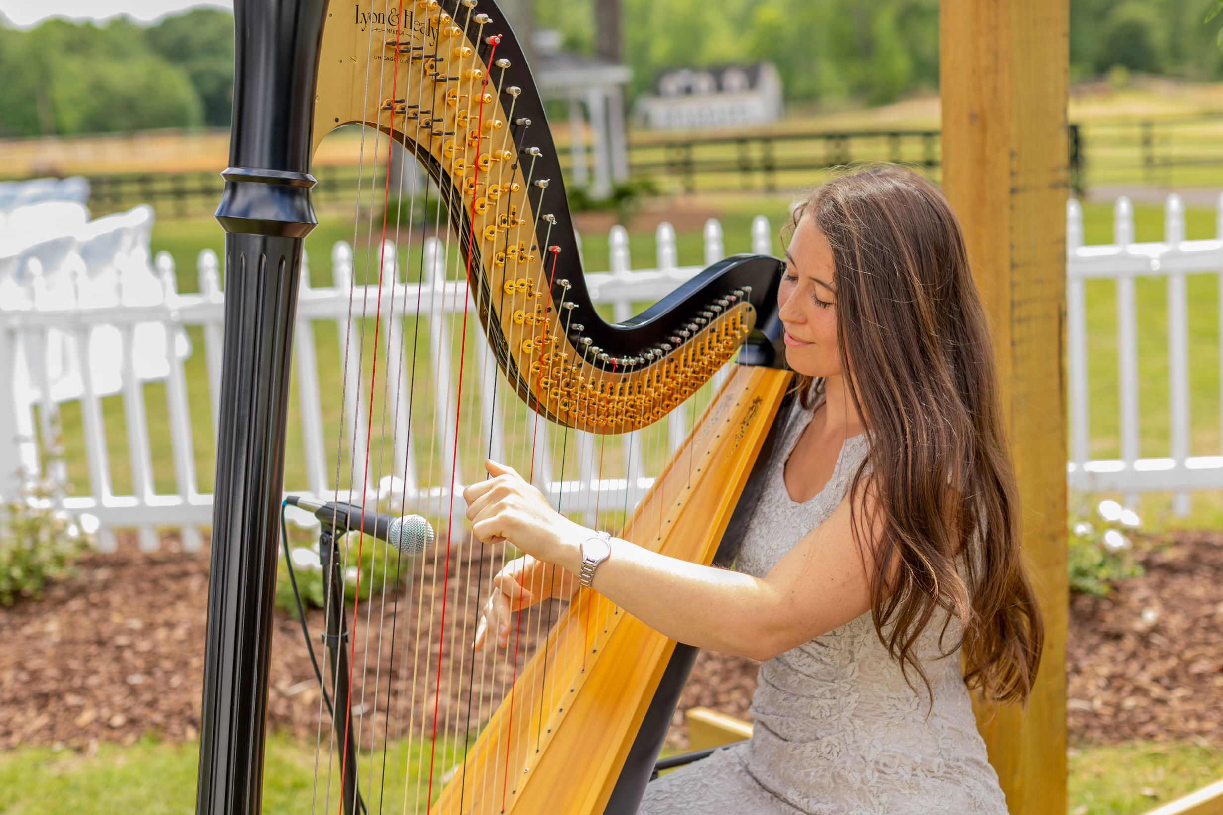 harp music in courtyard with garden party wedding in summer in Monroe, GA near Athens, Georgia