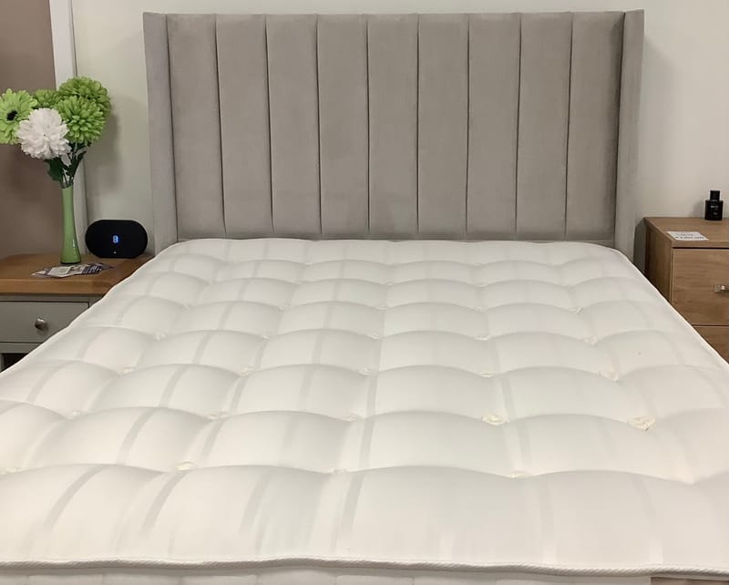 Winged floor standing headboard.