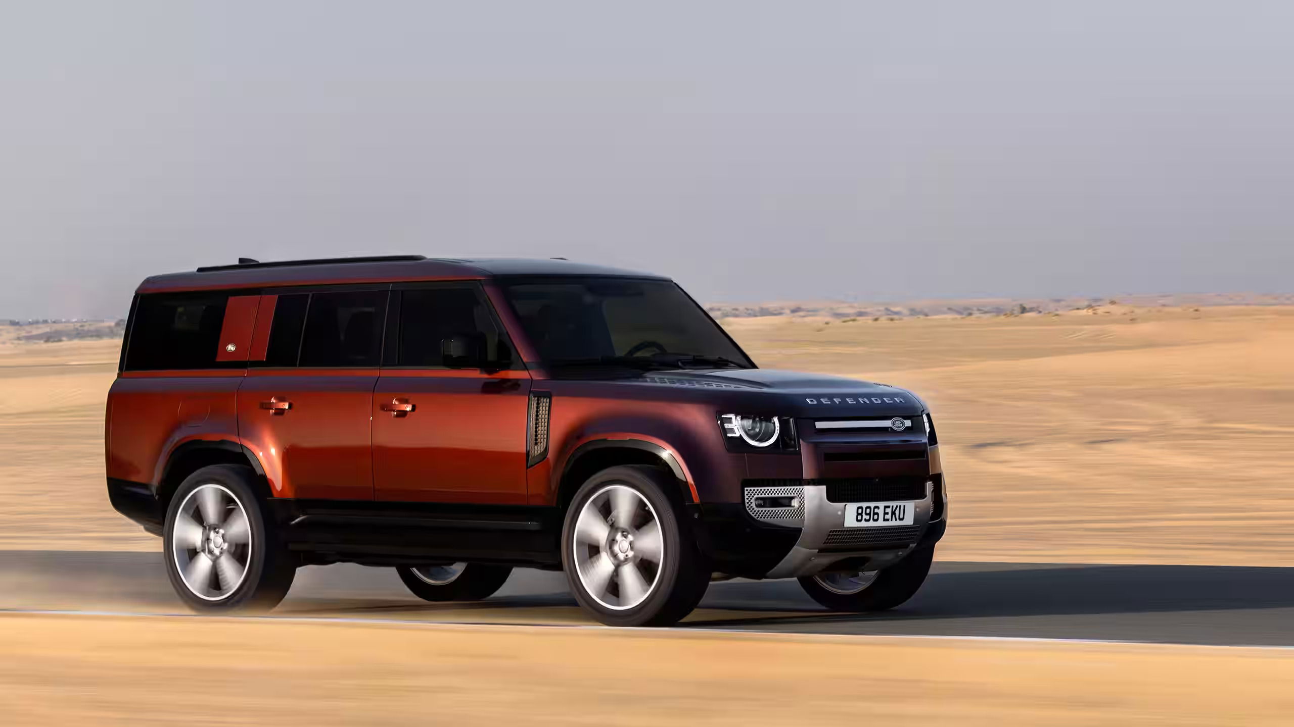 Land Rover DEFENDER_130_SEDONA_RED_DUBAI_ON-ROAD