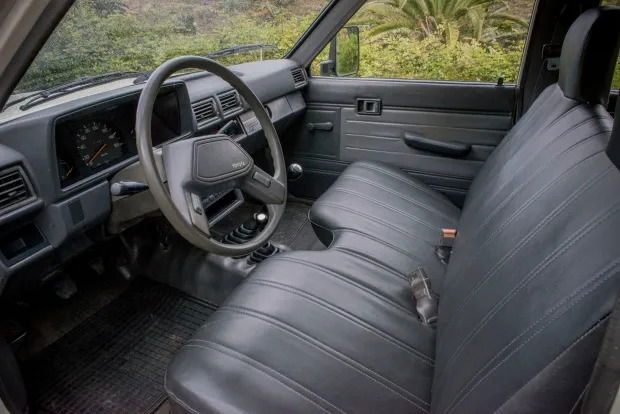 Indestructible pickup - 1988_toyota_hilux_interior via Bring a Trailer.