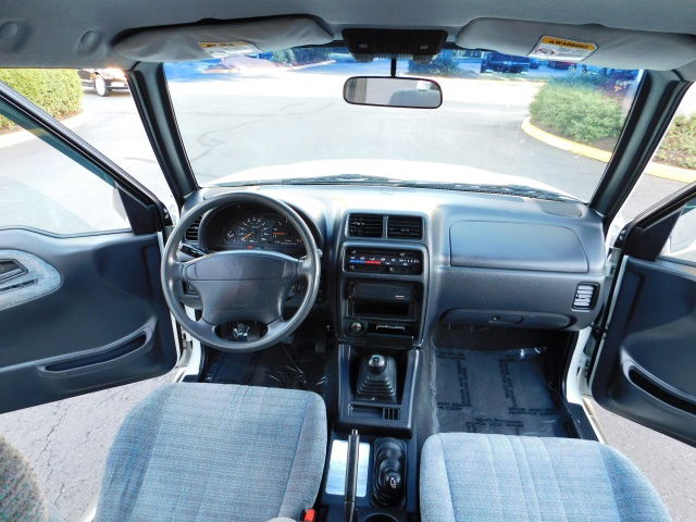 1997 Suzuki Sidekick JX Sport front cabin via M&M Investment Cars.