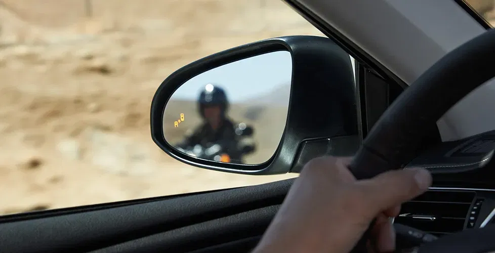 When did Toyota add blind spot monitor to the Camry?