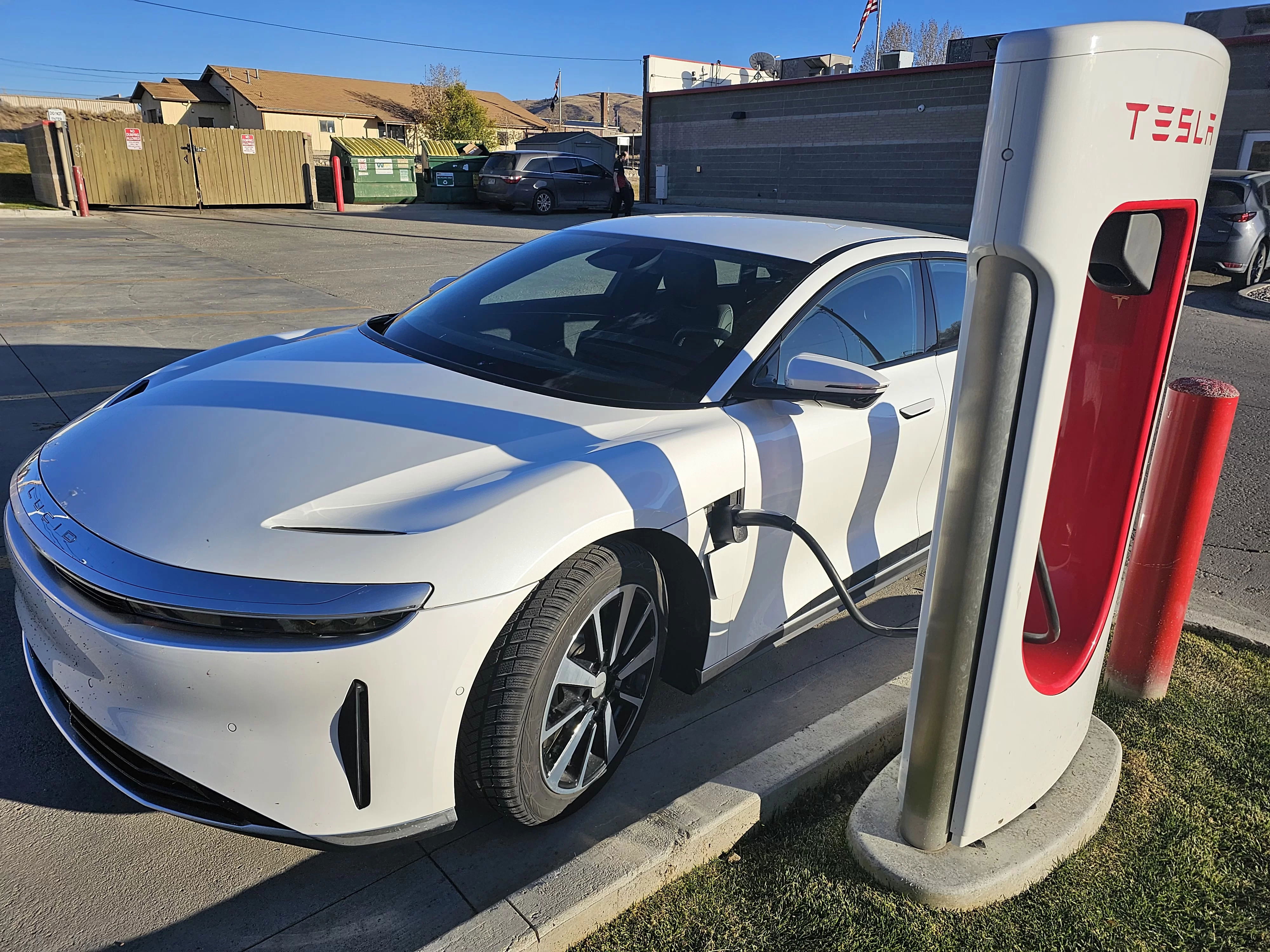 Charging at a Magic Dock Supercharger.