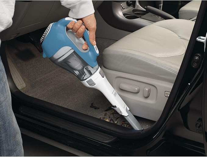 Road trip essentials: handheld car vacuum.