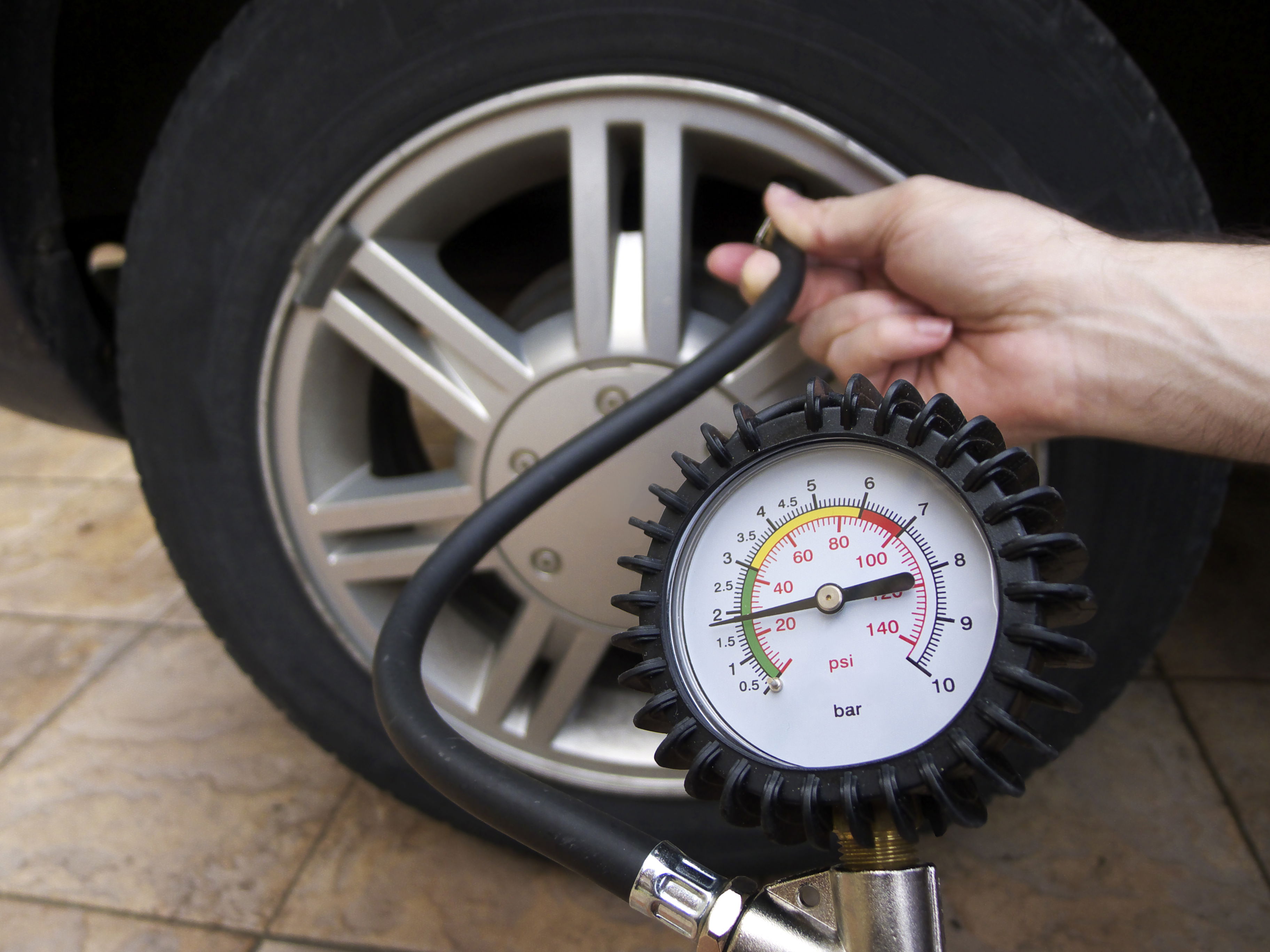 Summer essentials for every car owner: tire pressure guage.