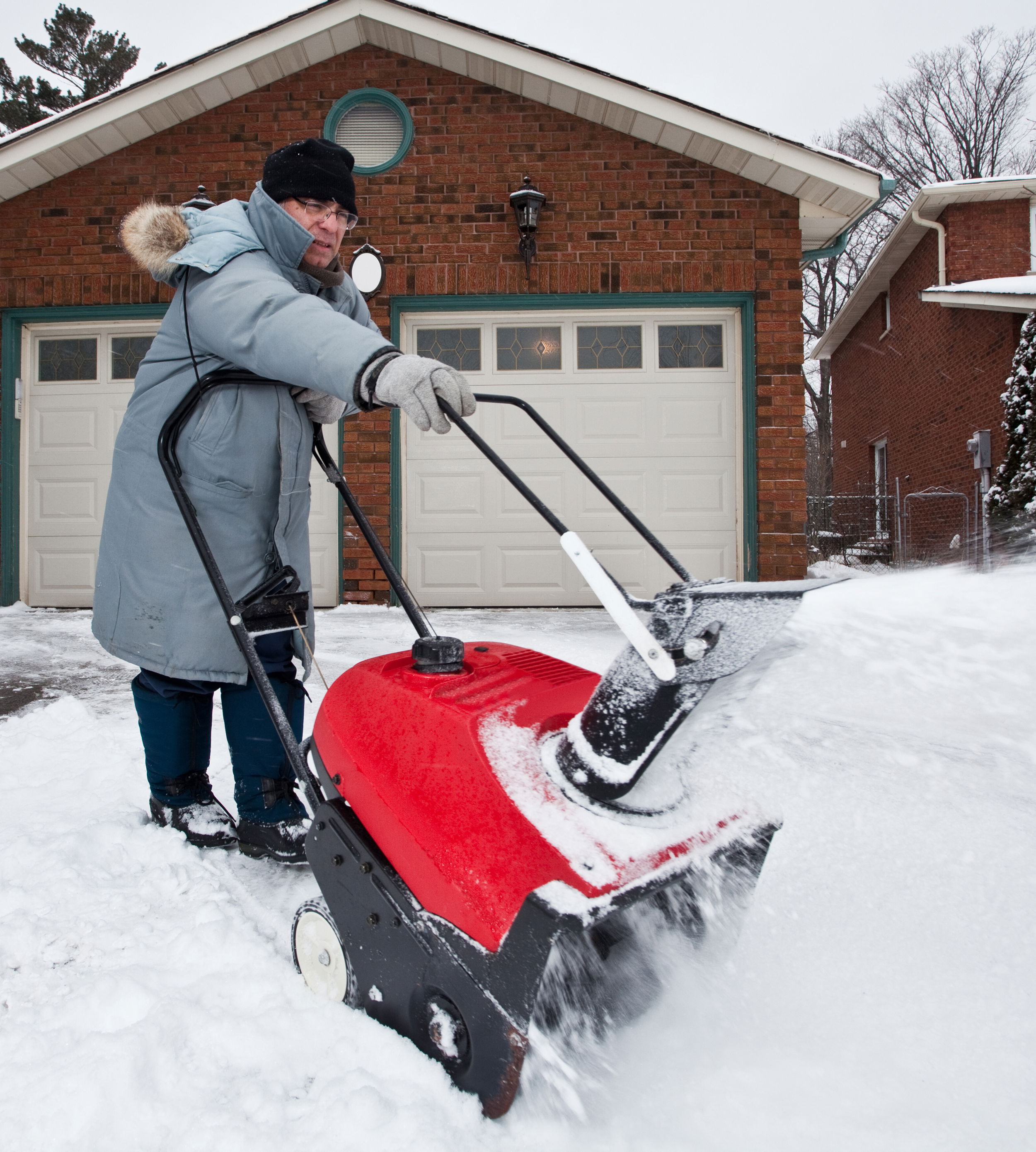 Battery-powered walk-behind snow blower.