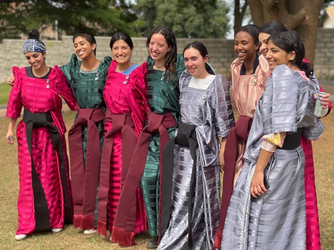 Tourists wearing gomesi