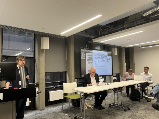 A group of people in a room  AI-generated content may be incorrect.