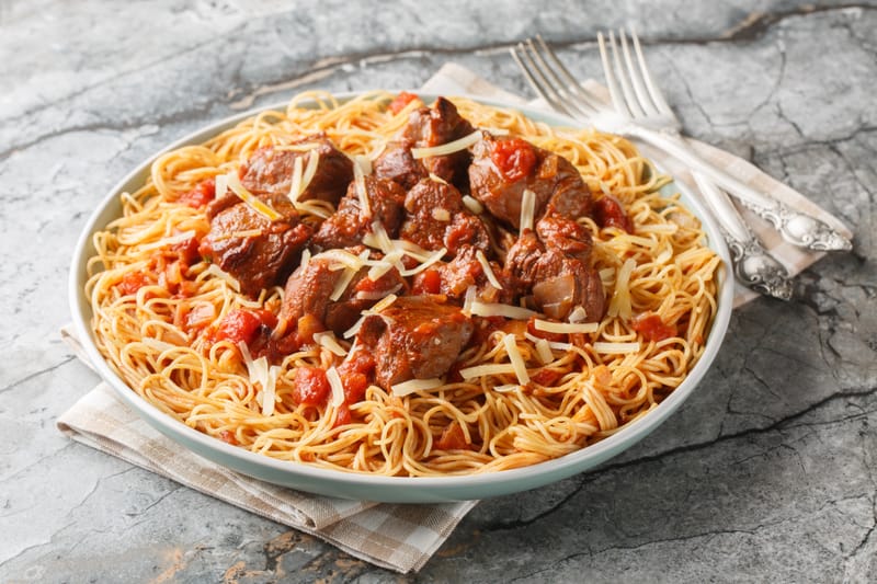 BEEF IN RED SAUCE SERVED WITH PASTA