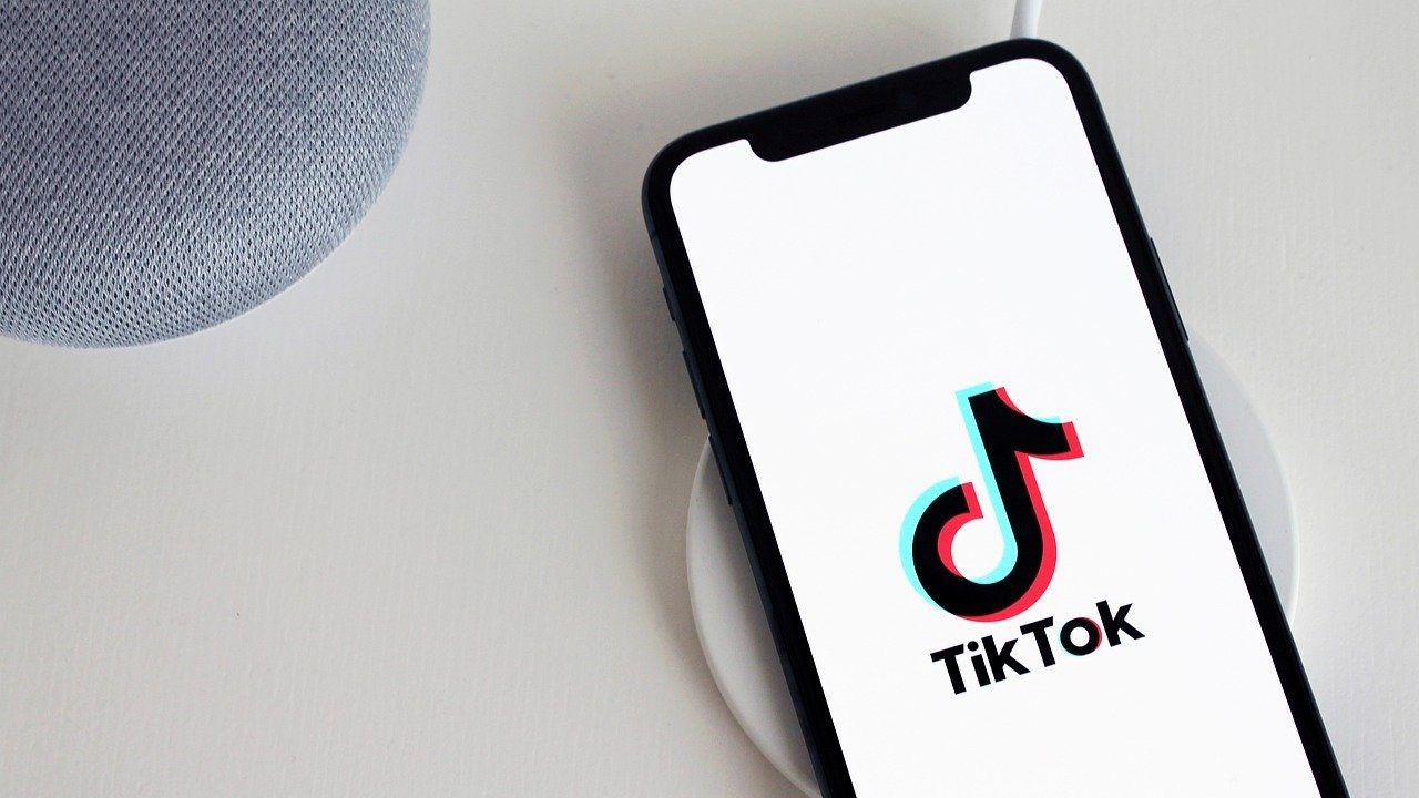 phone on charger with tiktok open - day in your life tiktok content idea