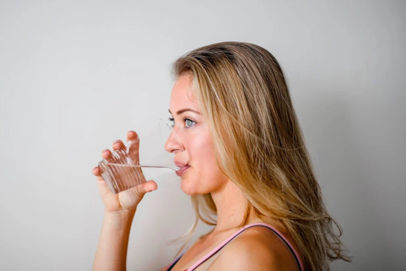 Stay Hydrated - woman drinking water from glass