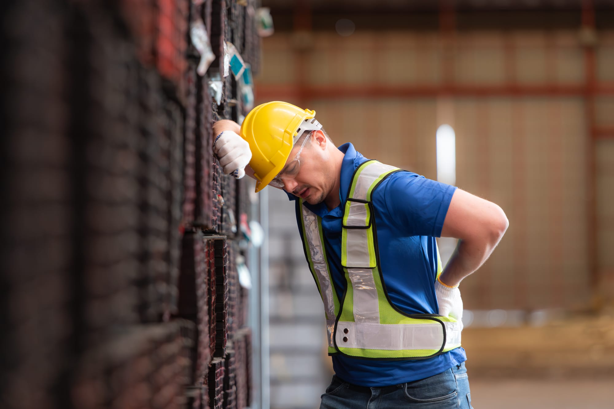 Warehouse Worker with Back and Shoulder Strain