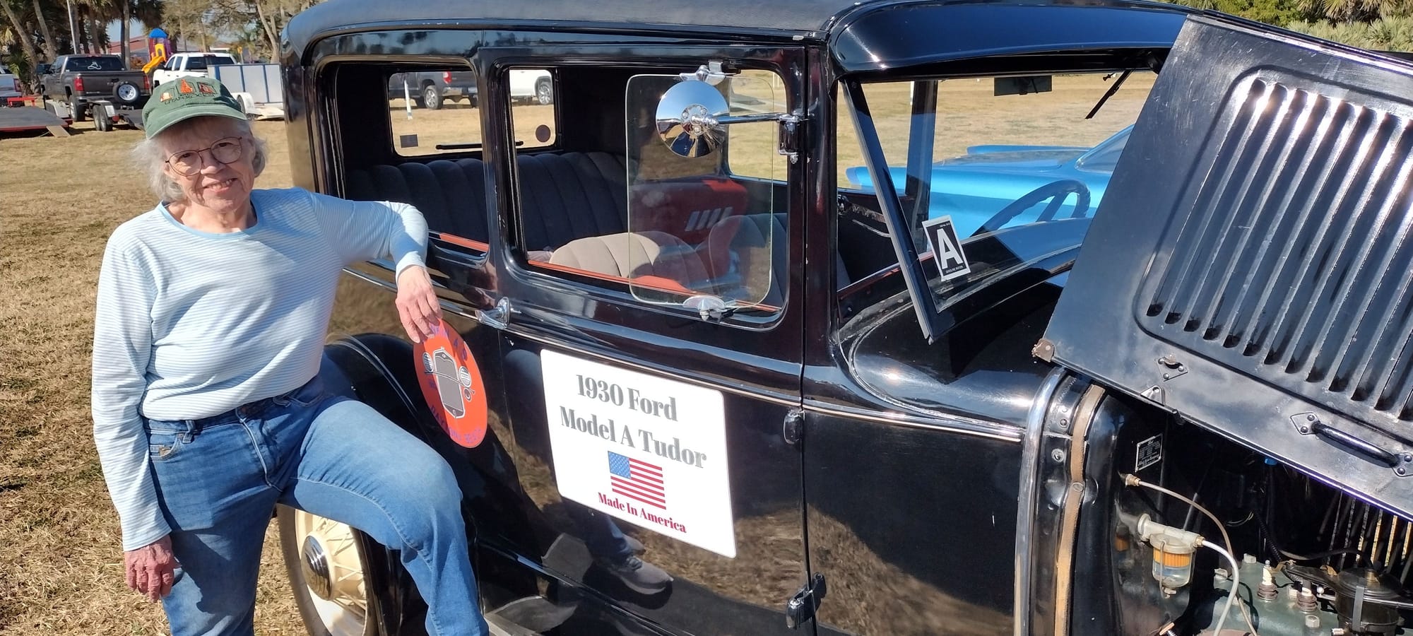 Kevin's sister visiting from Minnesota posing with his Tudor