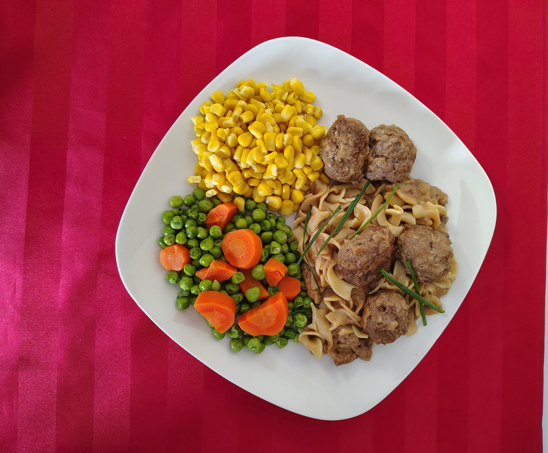 Swedish Meatballs over Buttered Noodles