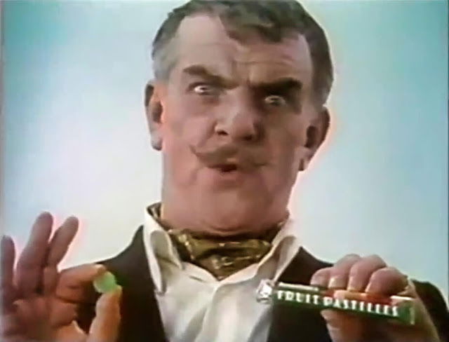 Windsor Davies holding a packet of Fruit Pastilles