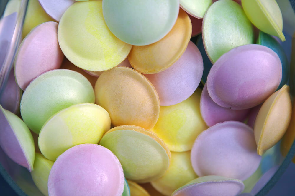 Selection of loose Flying Saucer sweets, mixed colours; pink, green, yellow and orange