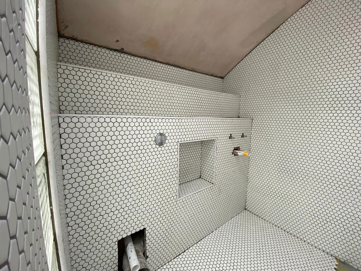 Penny mosaic bathroom tiling in a Hackney townhouse