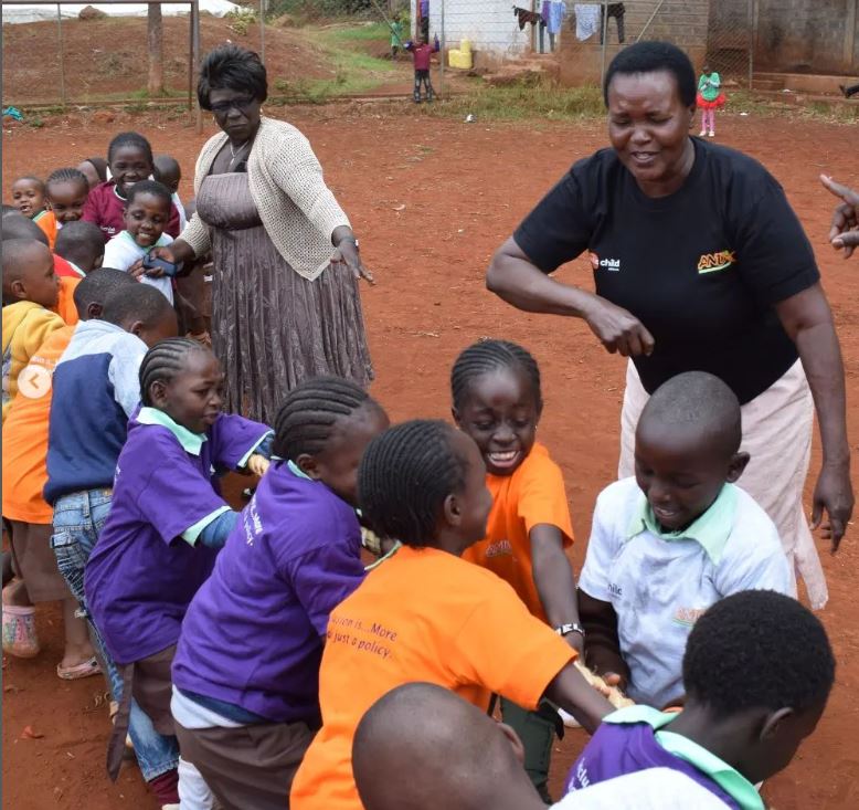 Children participating in a tug of war