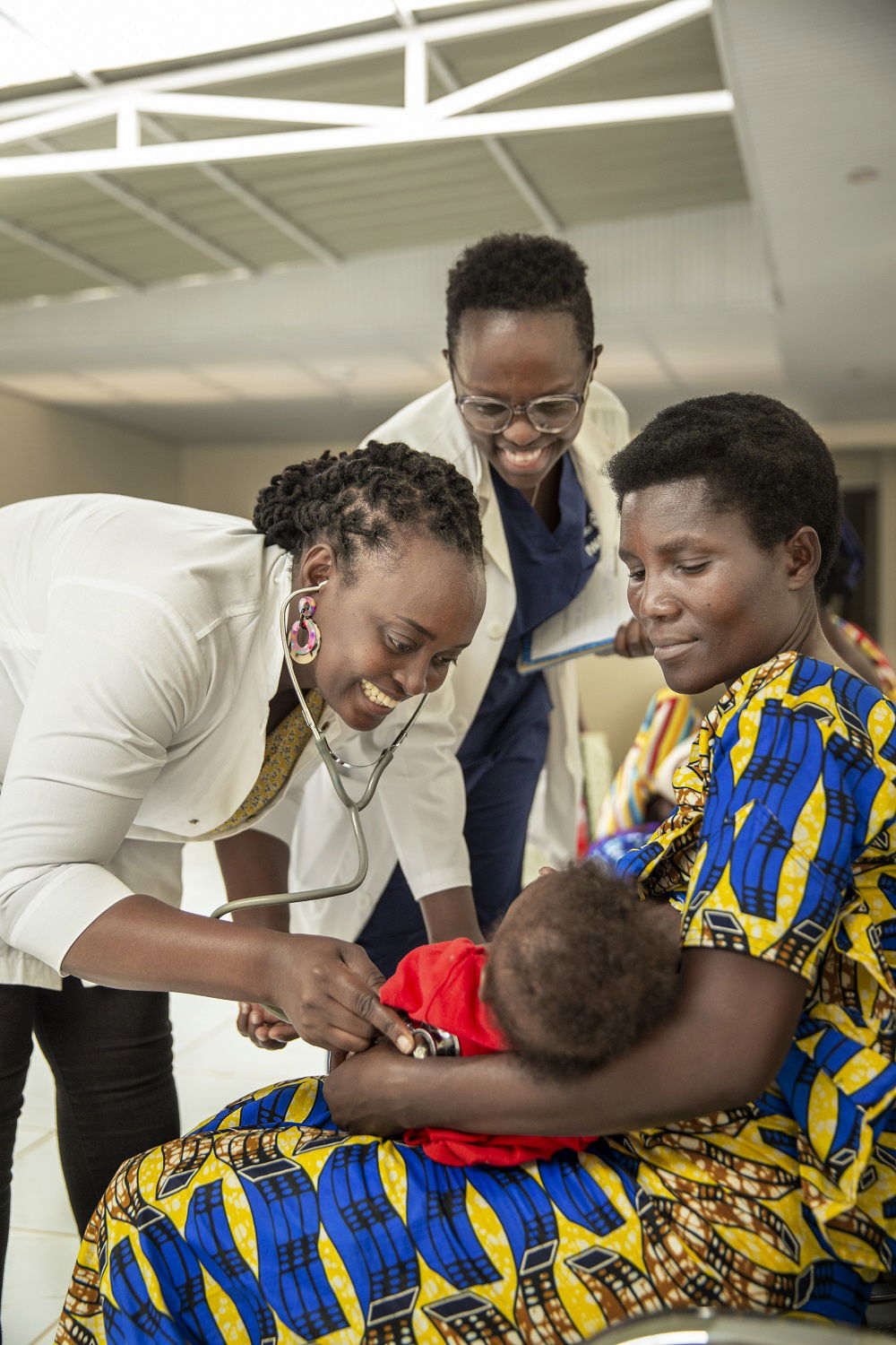 Doctors surrounding a child patient