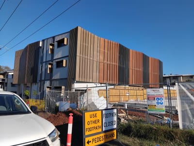 Corporate volunteers roll up their sleeves for new youth homelessness facility