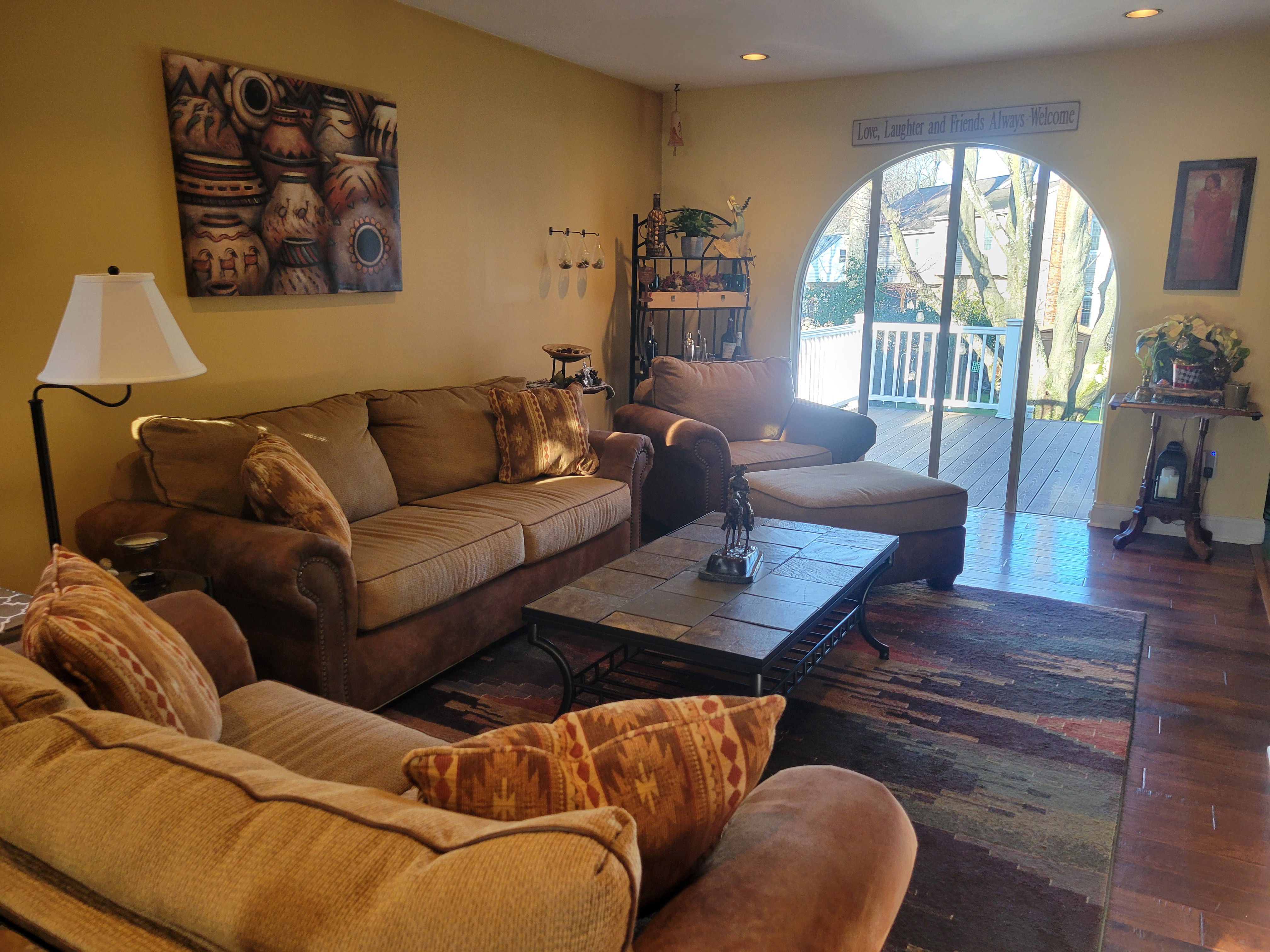 After:  Spacious Living Room; REunited the easy chair with its matching sofa and loveseat for additional seating!