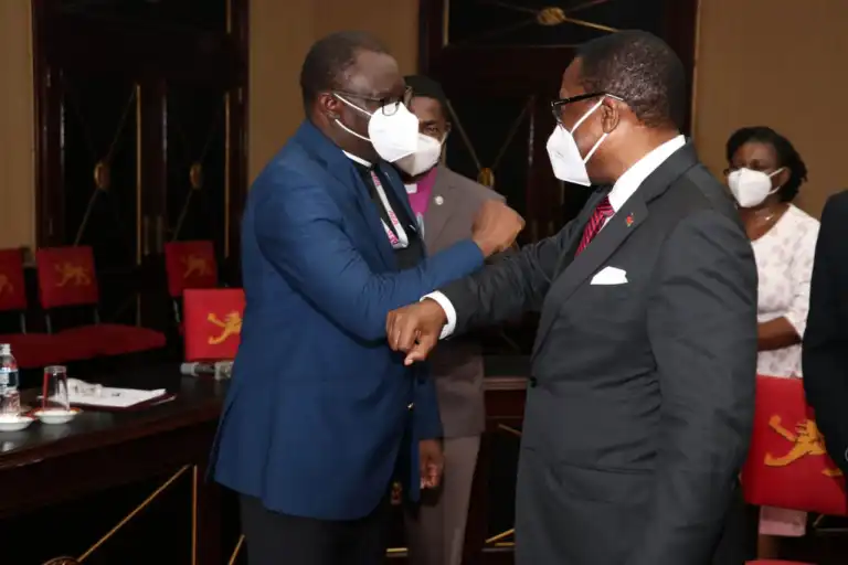 Dr. Eloi greeting Malawi President L.M. Chakwera