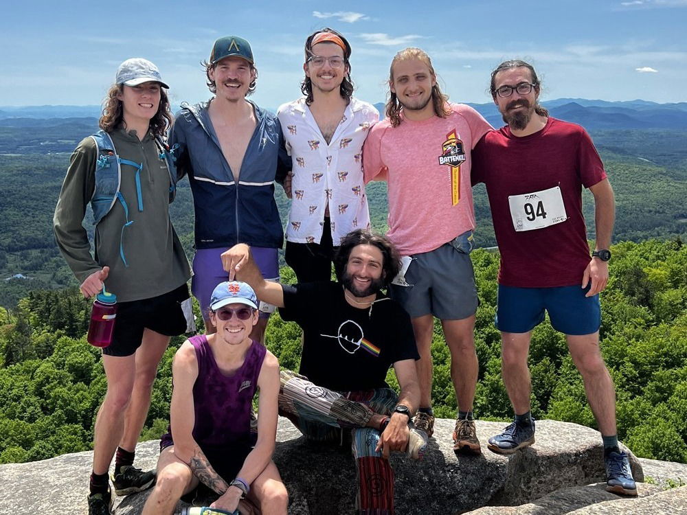 Smiling hikers on top of mountain