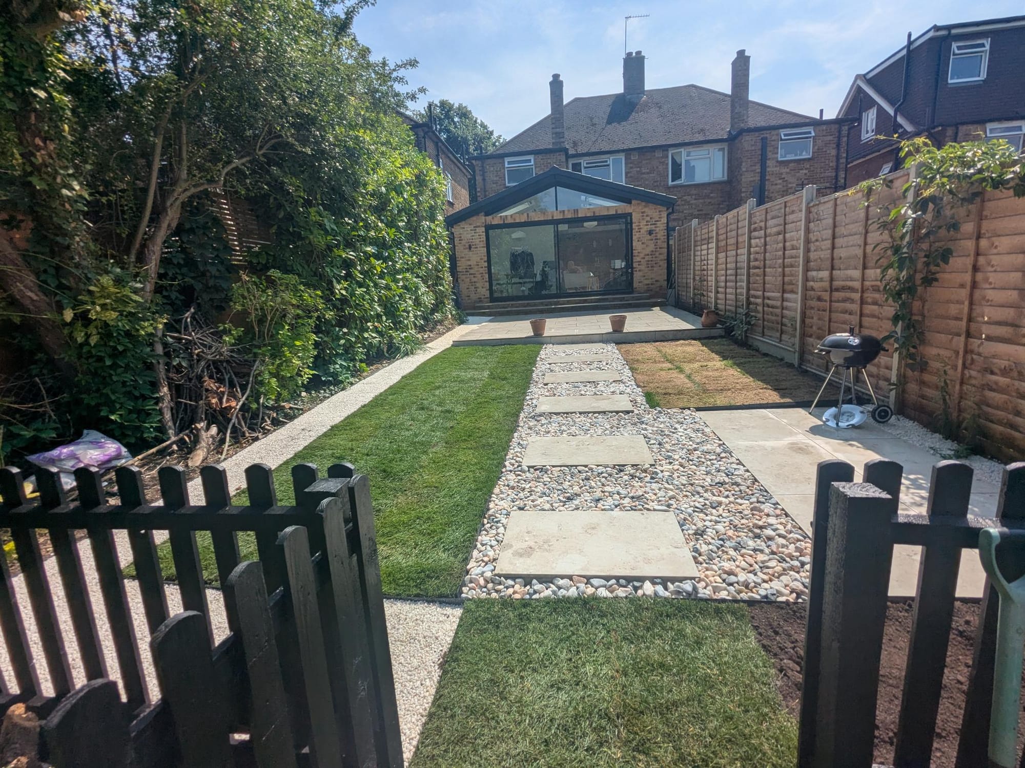 Patio, pathways, BBQ area and fencing installed