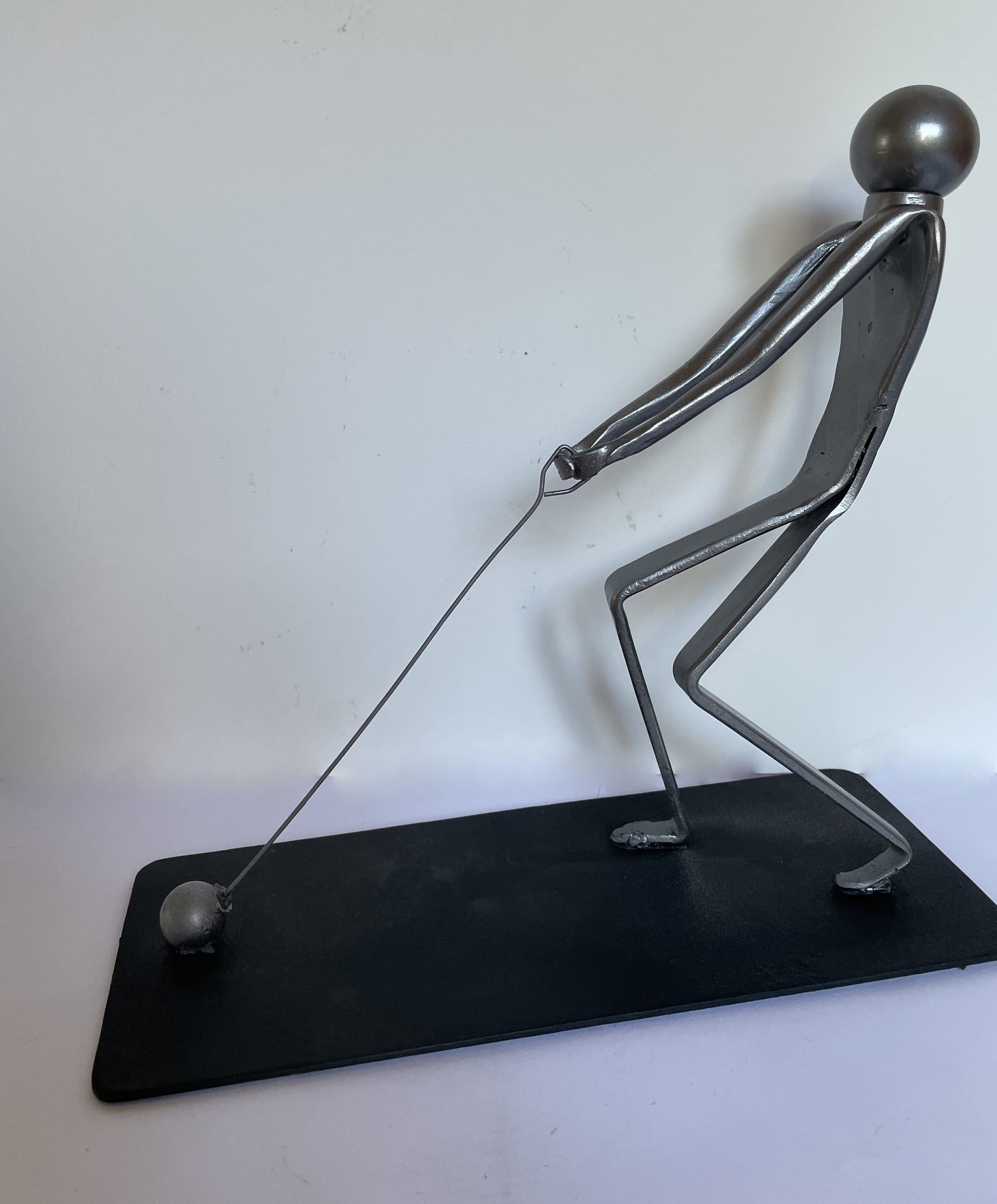 Le lanceur de marteau.