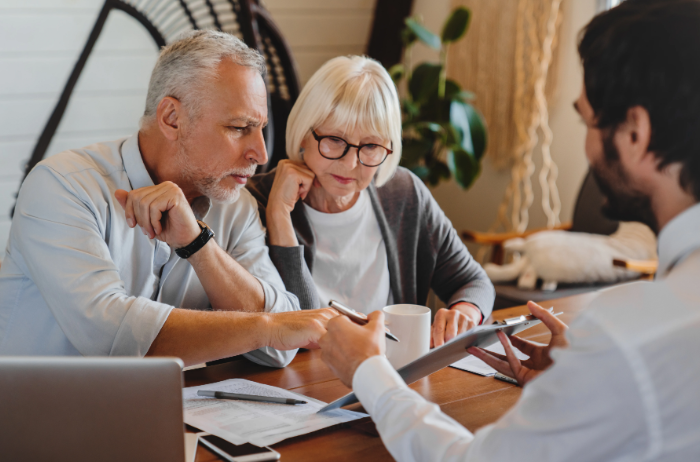 Professional advisor supporting an older couple
