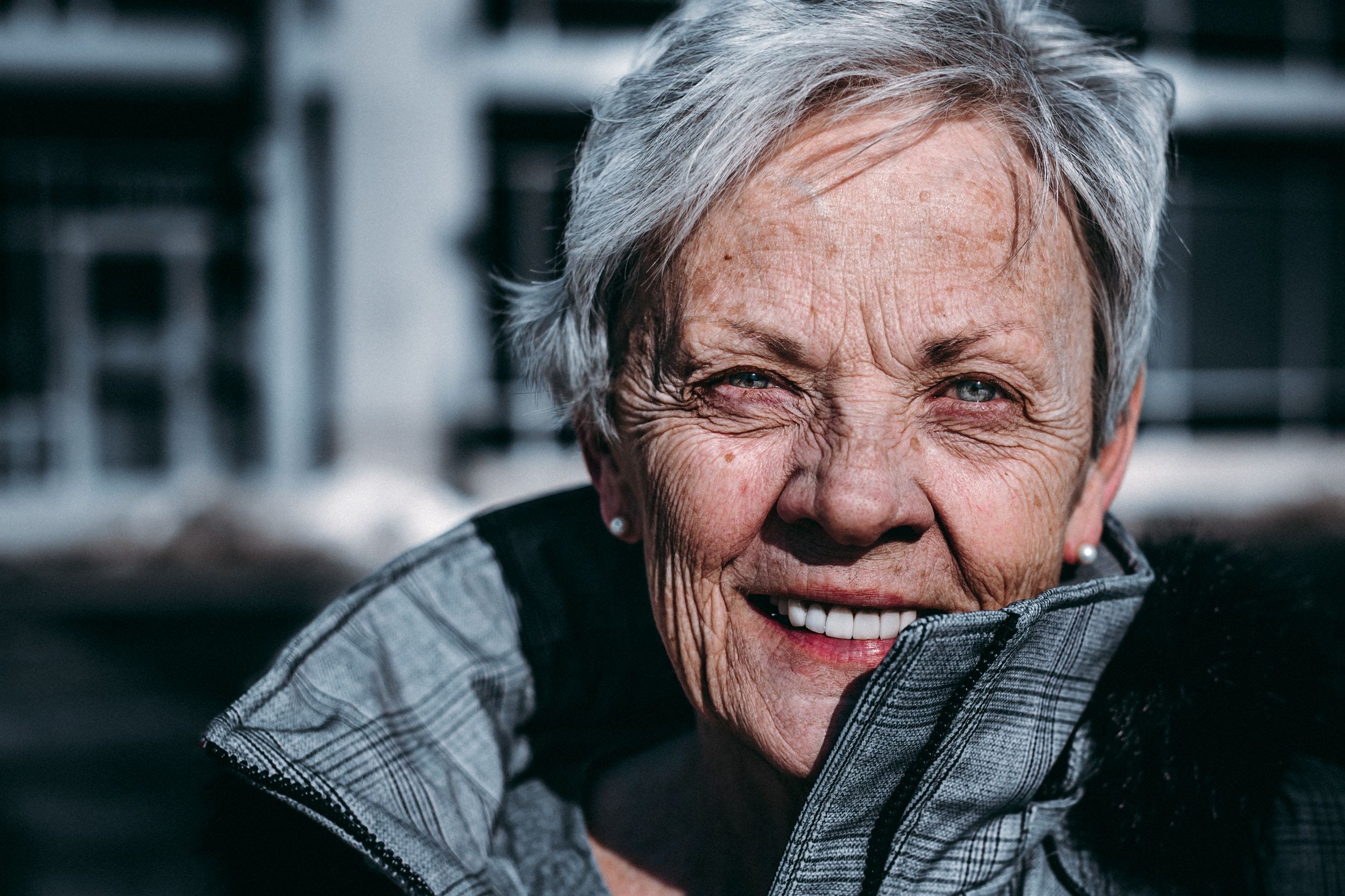 An older woman smiling, illustrating the importance of keeping the person and their wishes at the centre of LPA planning.