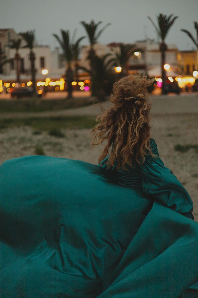 Walk on the beach with flying dress