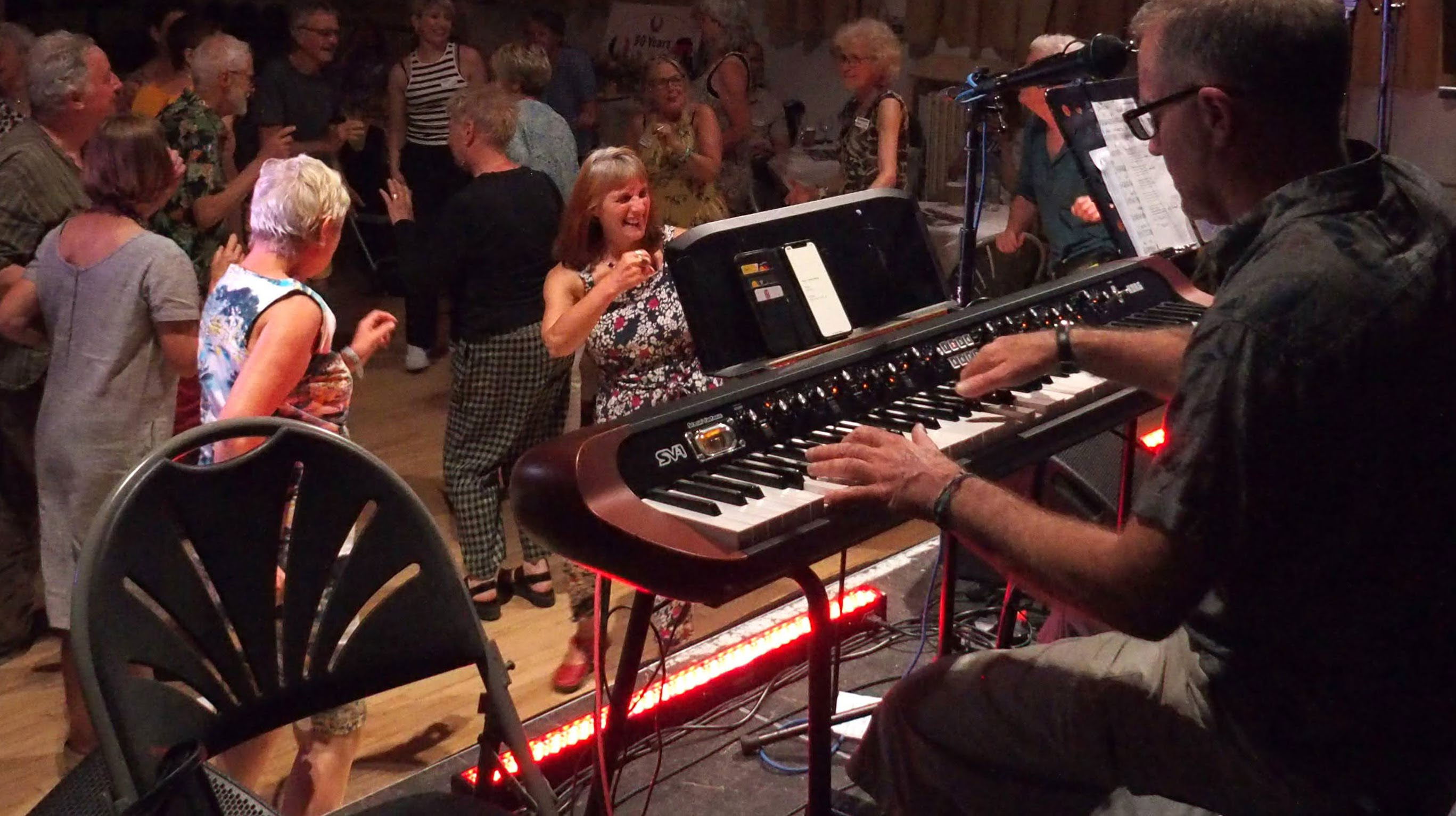 Bobby Gilbert playing piano at the Twinning Fest in the Town Hall in Wirksworth June 2023