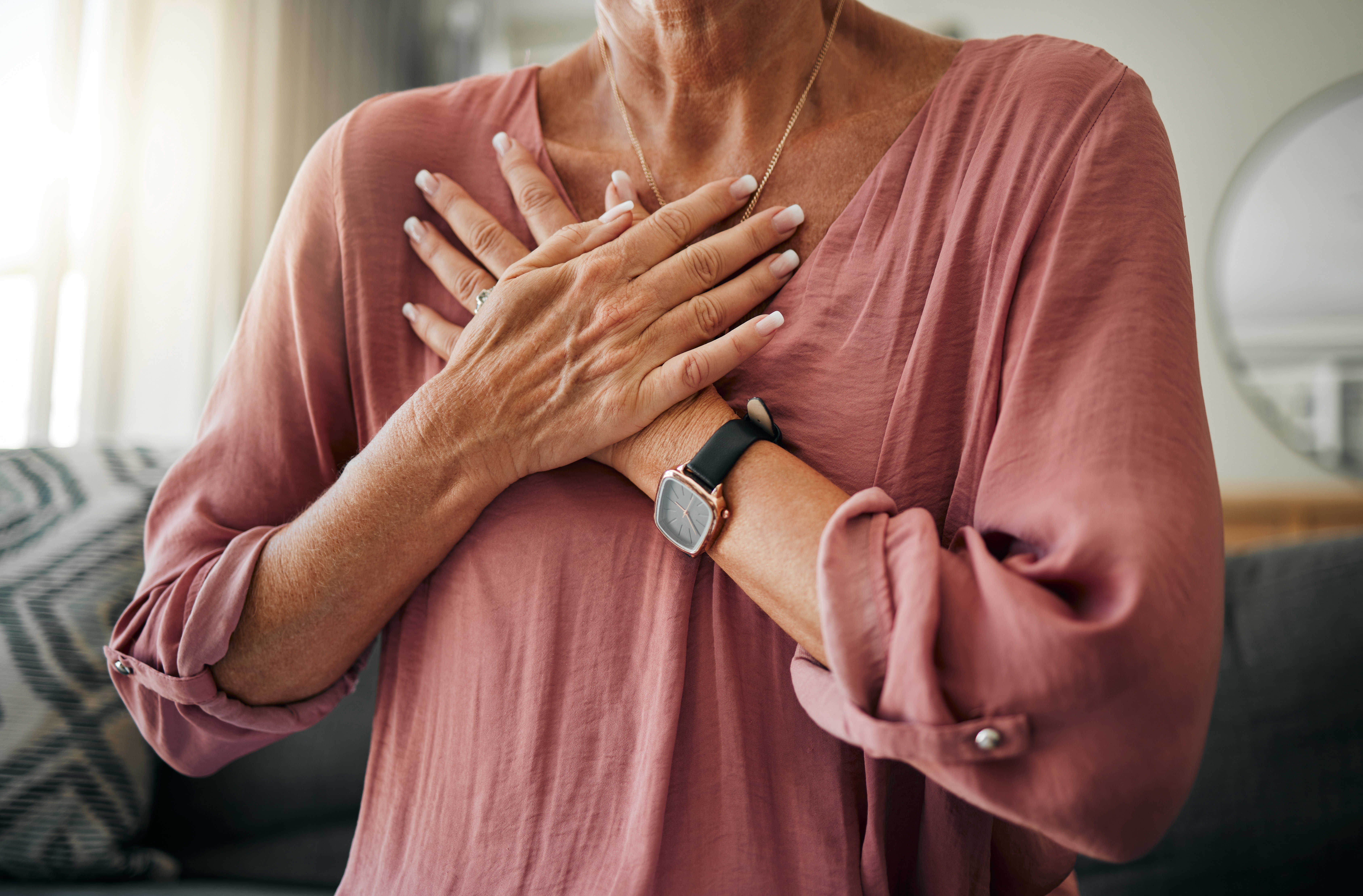 Hands tapping on chest representing bilateral stimulation in EMDR