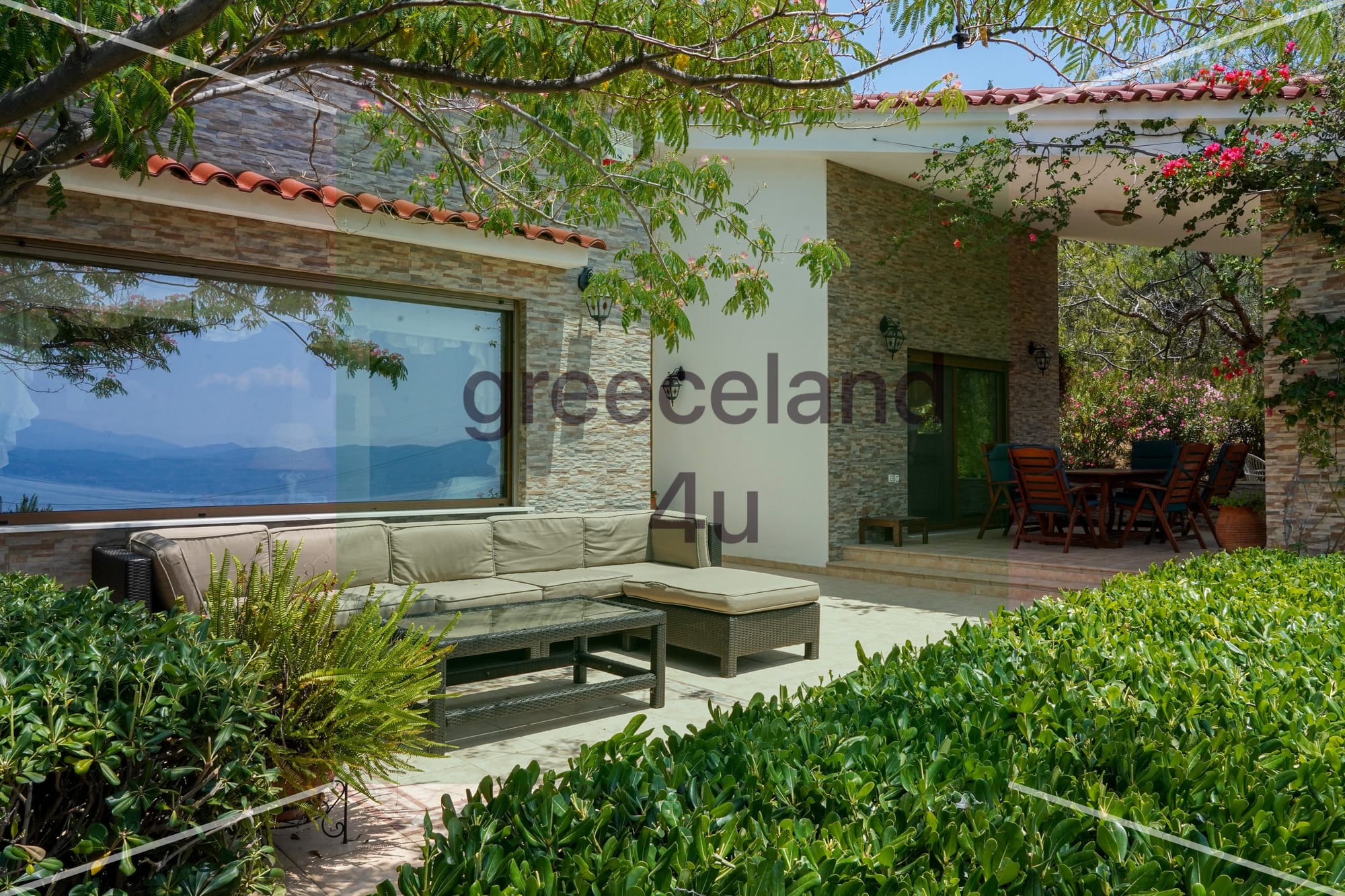 Located on a private 4,000 m² plot with stunning panoramic sea views over the Euboean Gulf.