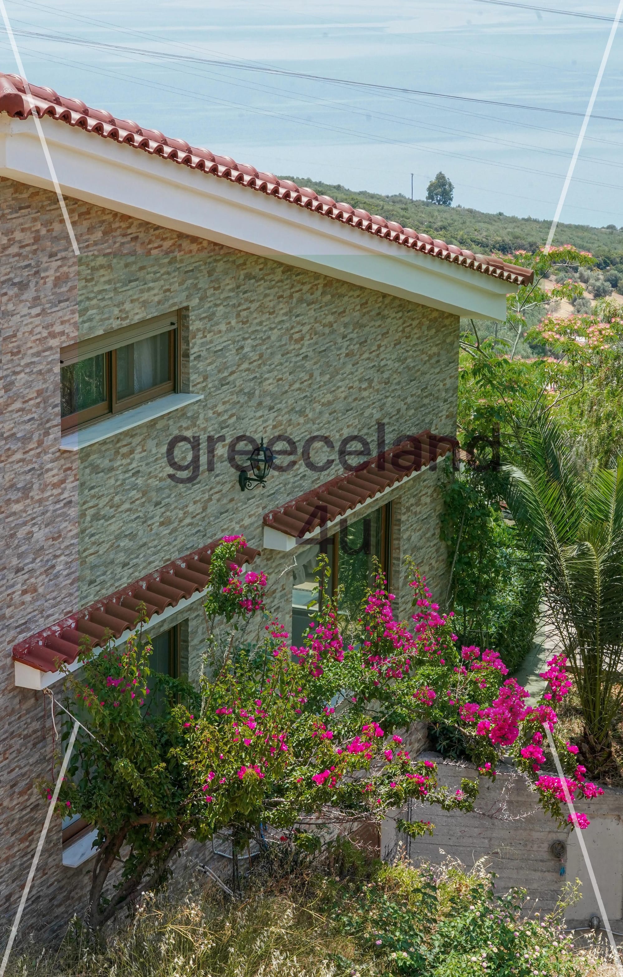 Located on a private 4,000 m² plot with stunning panoramic sea views