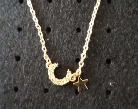 Celestial Harmony: Gold-Plated Star & Rhinestone Moon Pendant - R250.00