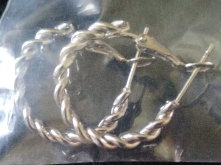 Half-Twist Silver Hoop Earrings – Timeless Elegance with a Modern Twist - R150.00