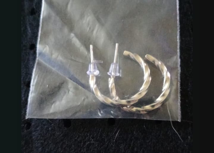 Twisted Silver Hoop Earrings – Elegance in Motion - R 150.00