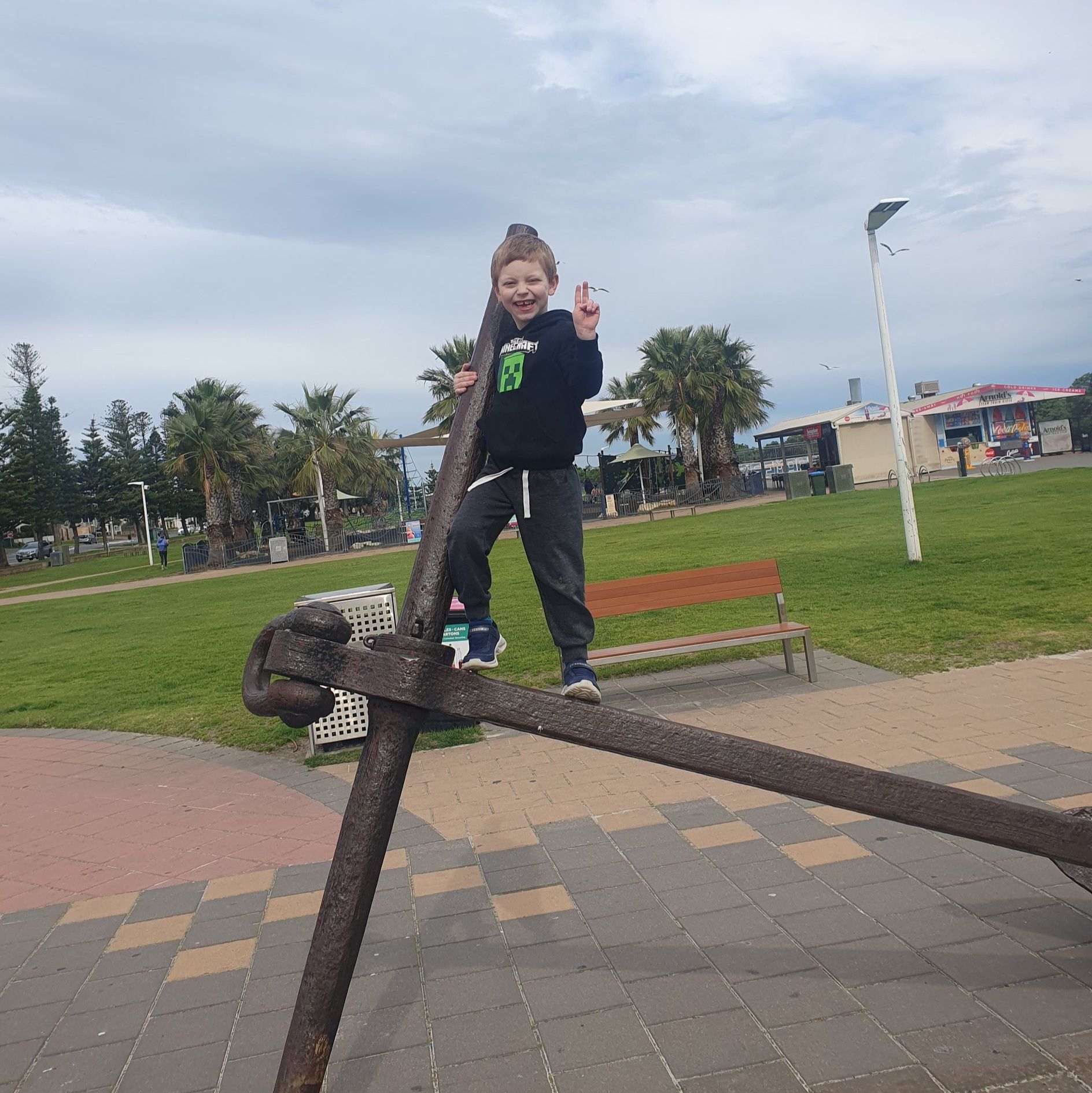 Hunter climbing the anchor at Semaphore Beach, SA