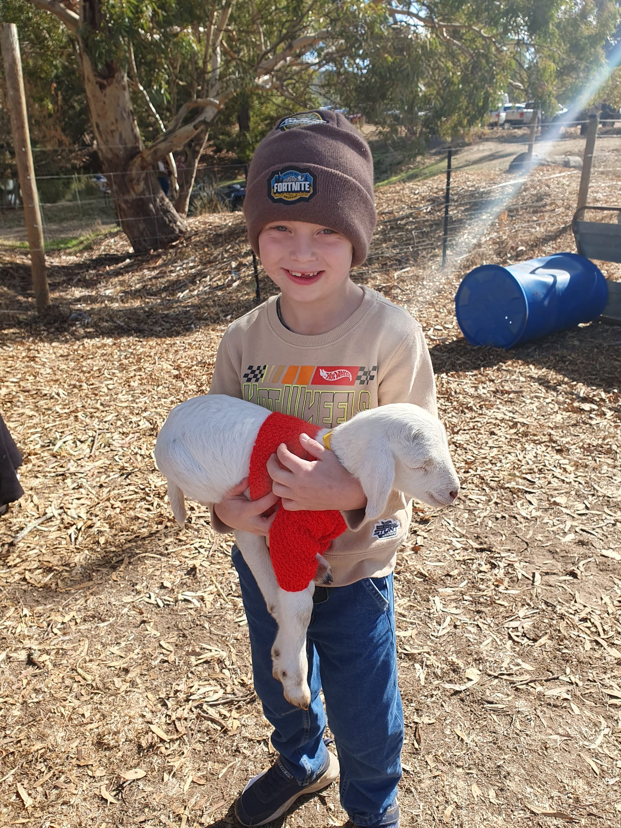 Hunter with a baby lamb at the Handorf Farm Day