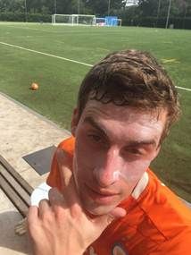 A person with sunscreen on his faceAI-generated content may be incorrect.