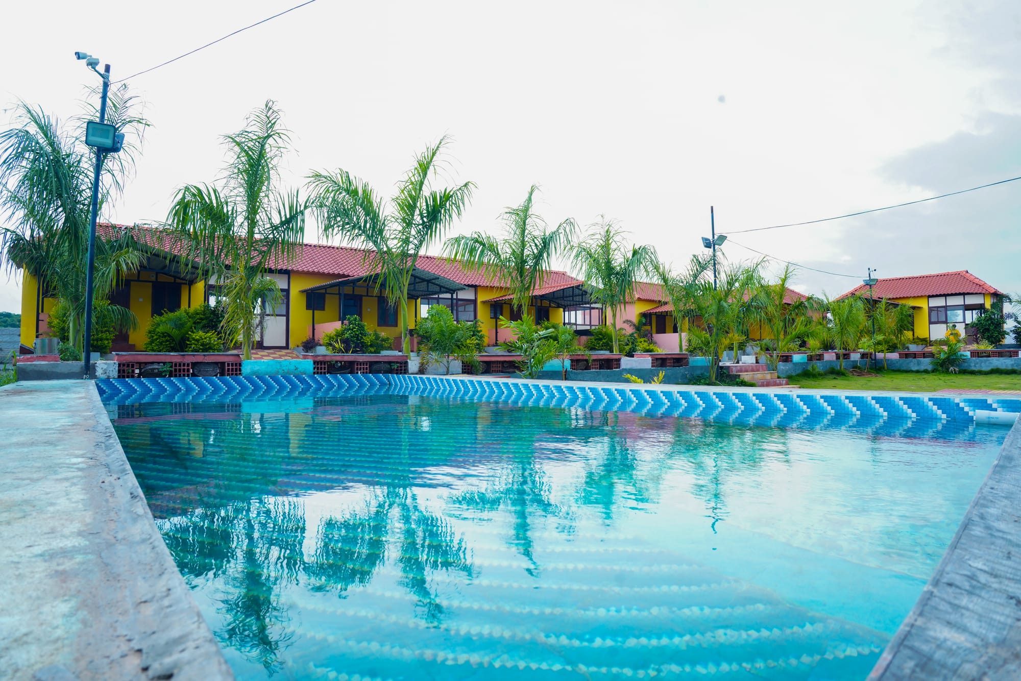 COTTAGES,LAWN AND POOL